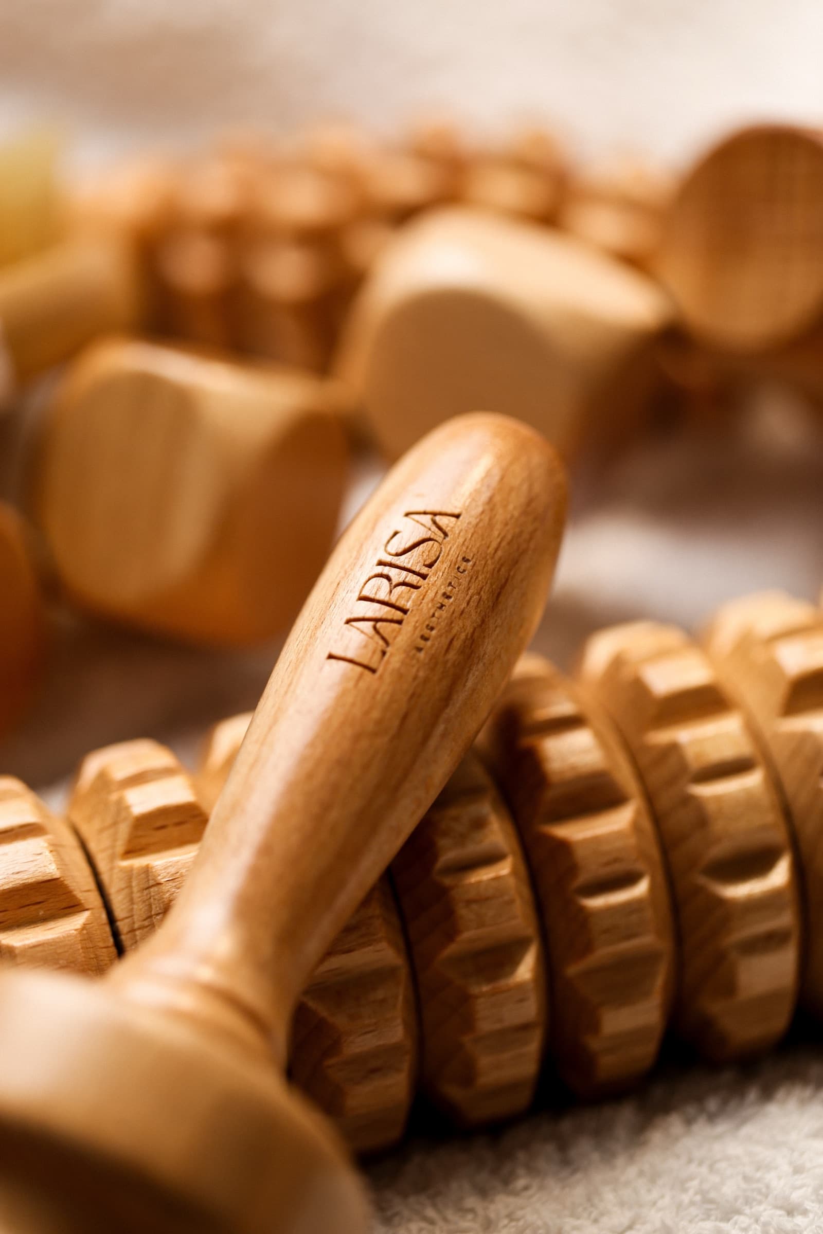 Larisa maderotherapy roller, engraved handle in close detail