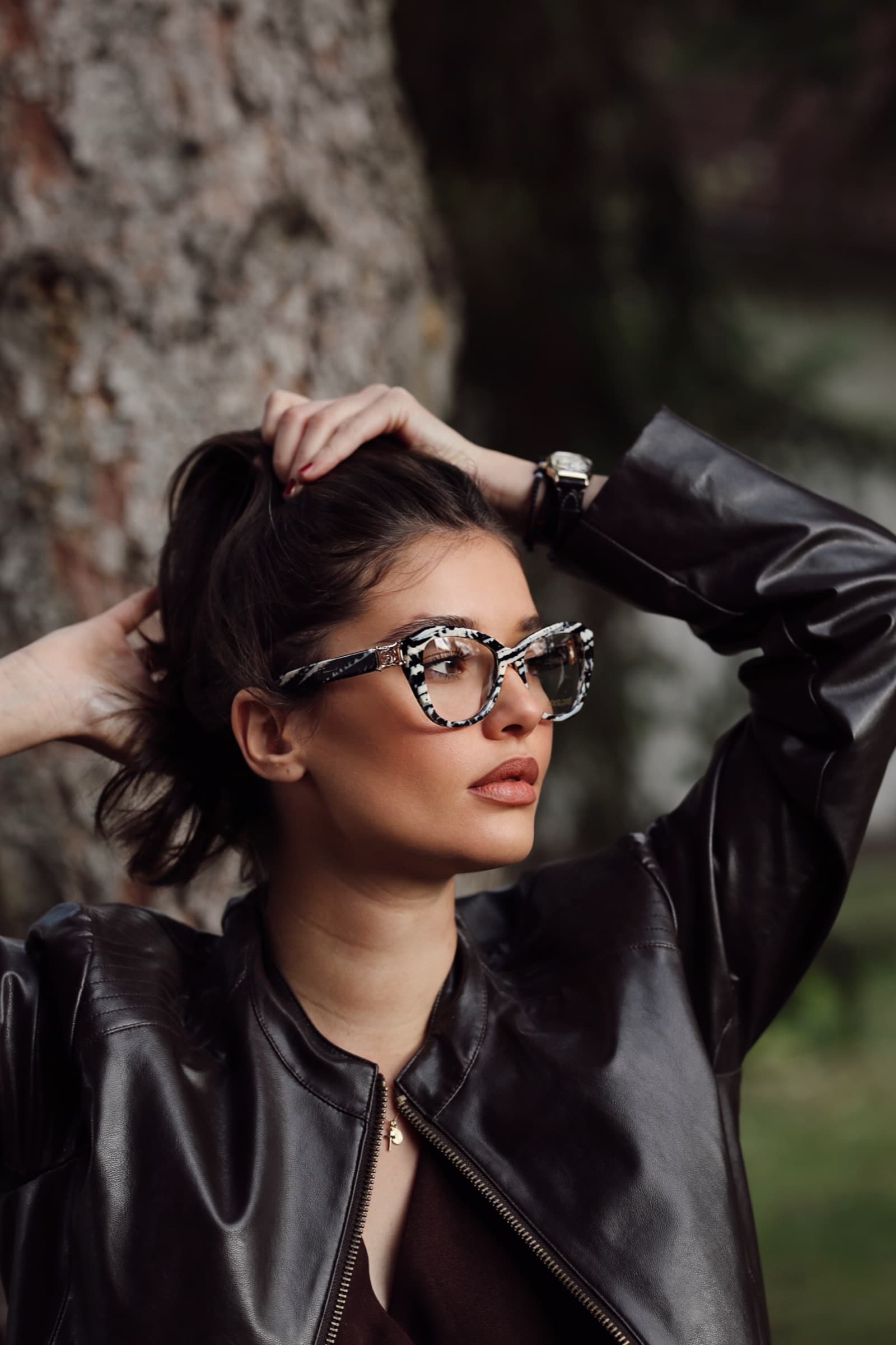 Leopard-print cat-eye sunglasses and a black leather jacket