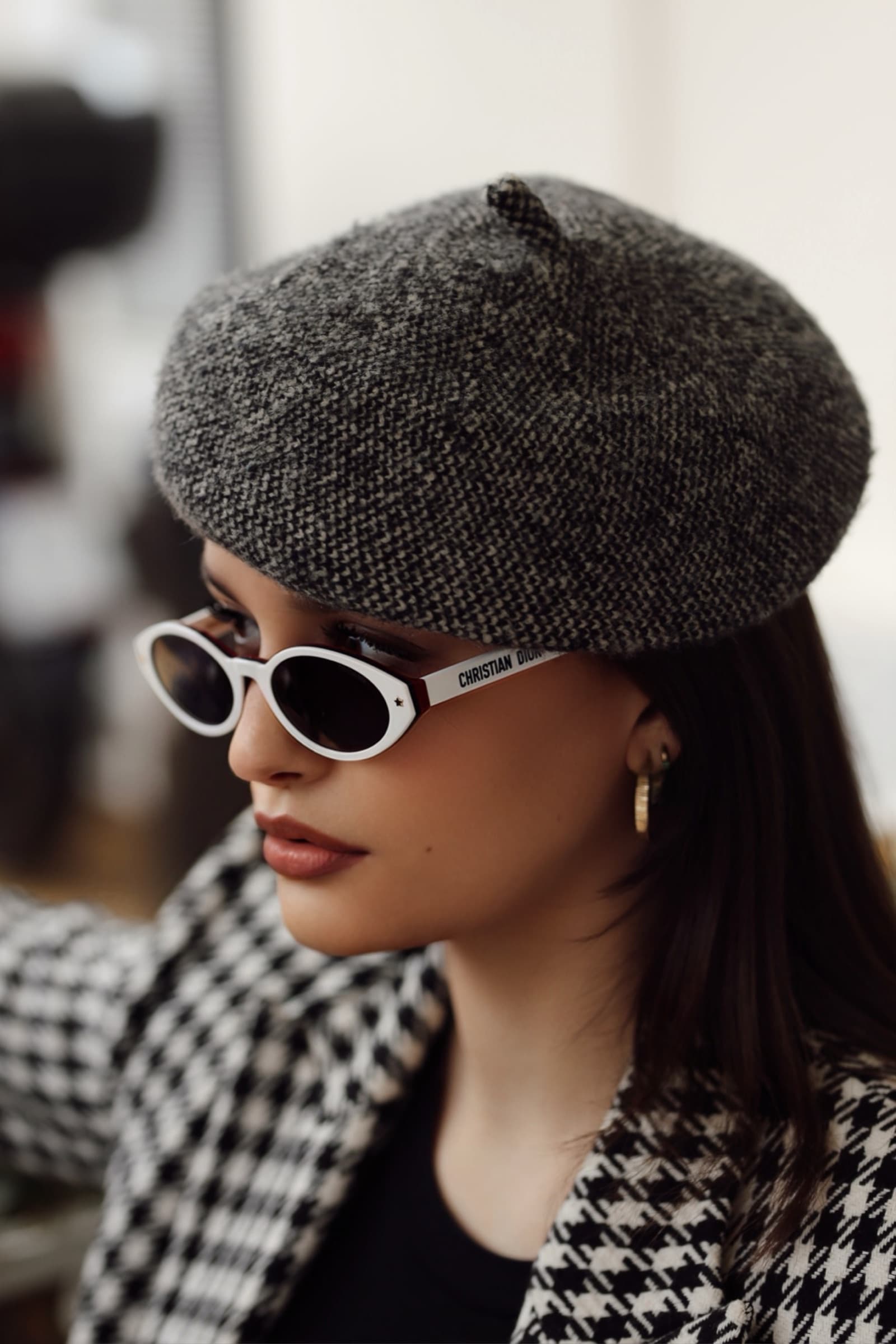 Profile in a wool beret and white oval sunglasses