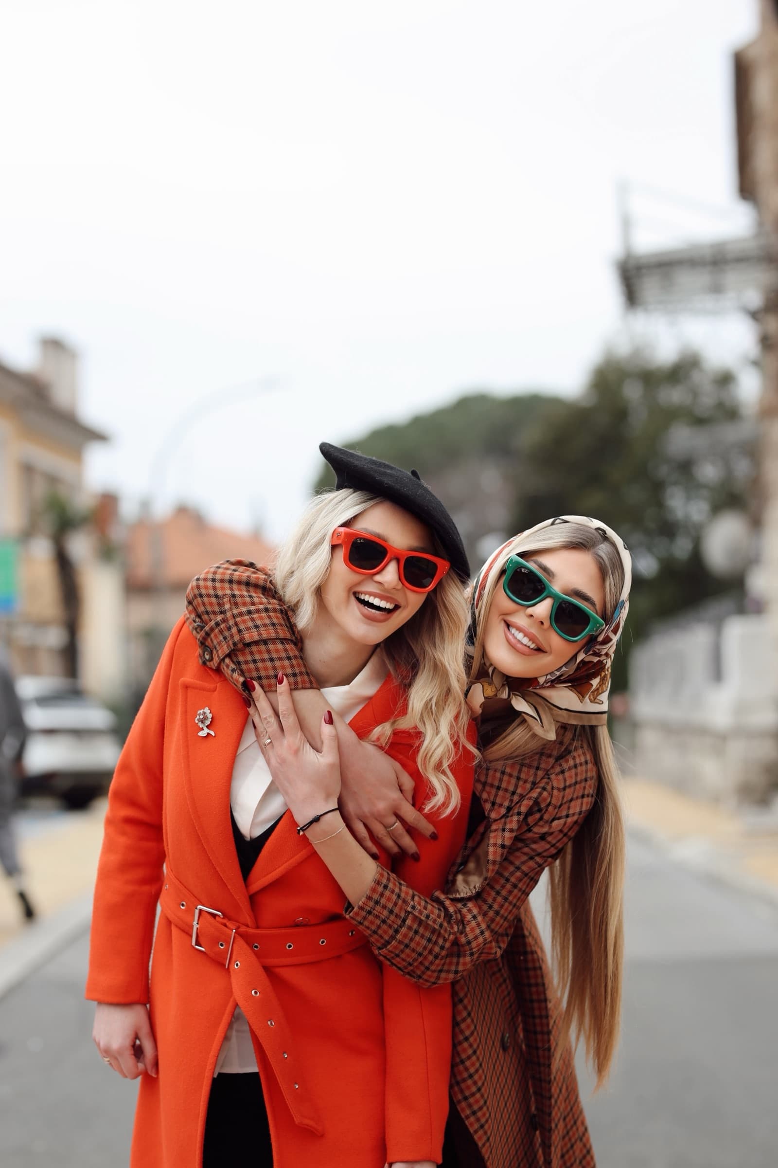 Orange suit and check coat, laughing on the corner