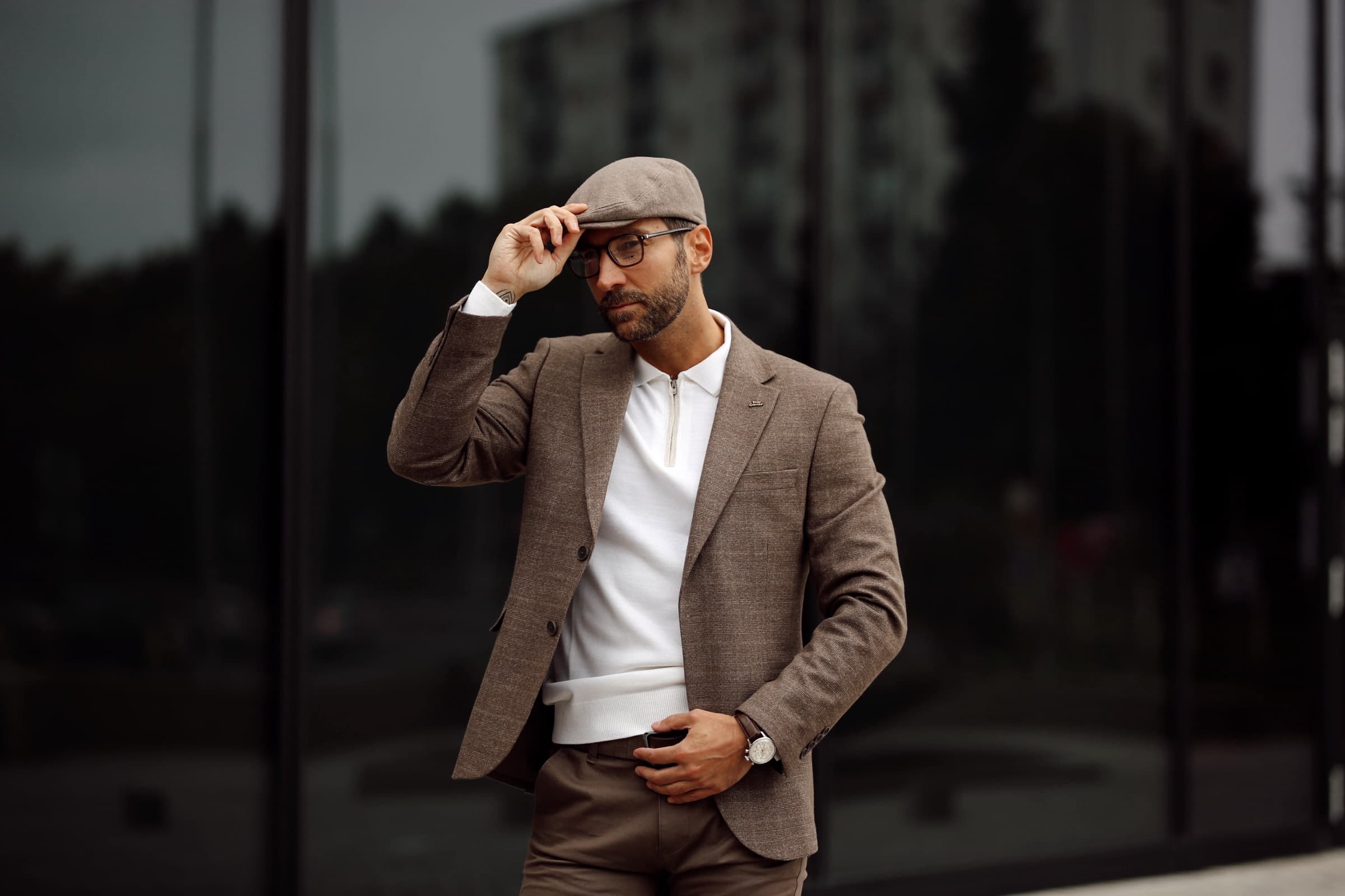 Portrait of a man in a linen blazer and flat cap