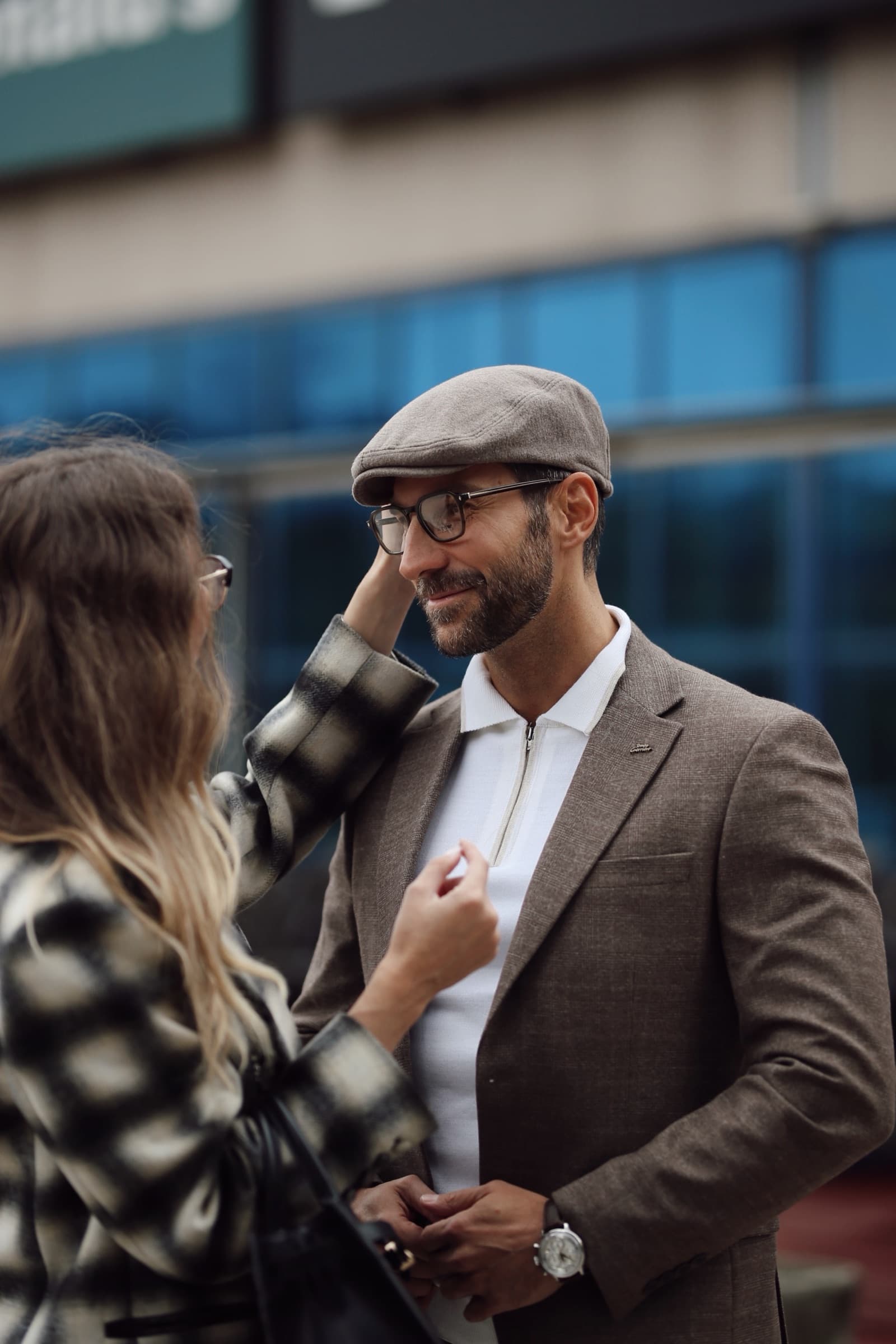 A styling adjustment on location, glasses and tweed